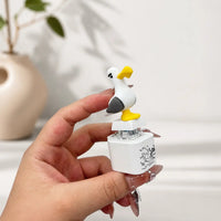 Close-up of the seagull button and base