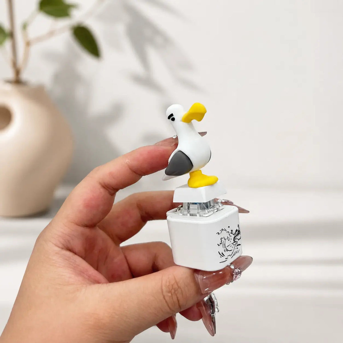 Close-up of the seagull button and base