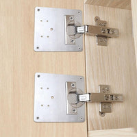 Cabinet hinge repair plate installed on cabinet doors