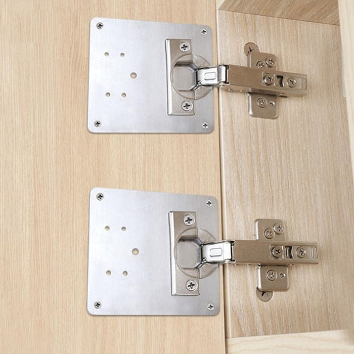 Cabinet hinge repair plate installed on cabinet doors