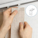 Clear repair tab aligned with a vertical blind hanging slot