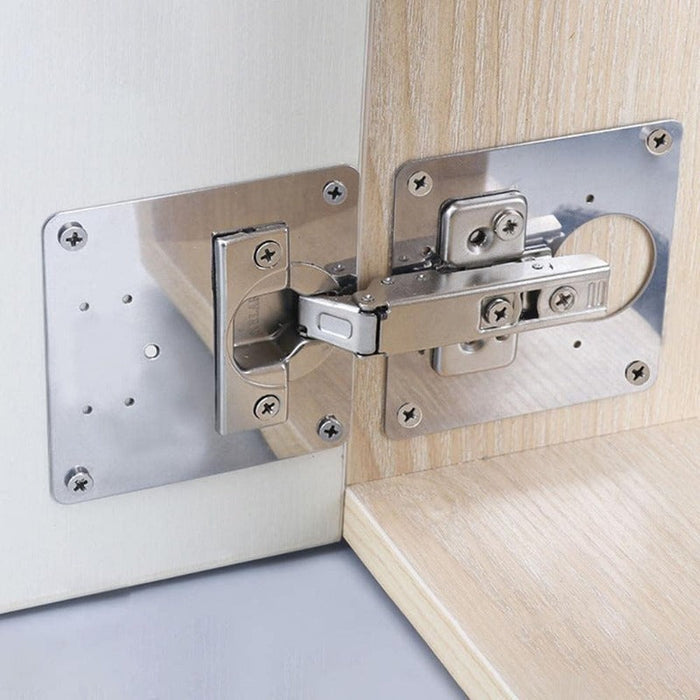 Cabinet hinge repair plate mounted on door and frame