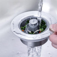 Sink drain strainer catching food scraps while water drains