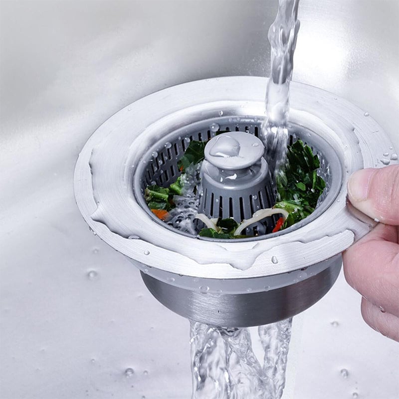 Sink drain strainer catching food scraps while water drains