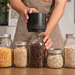 Cordless vacuum sealer positioned on a mason jar
