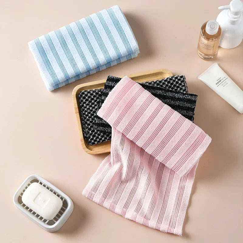 Exfoliating back towel color options laid out together