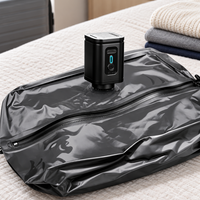 Black portable pump resting on a black vacuum travel bag